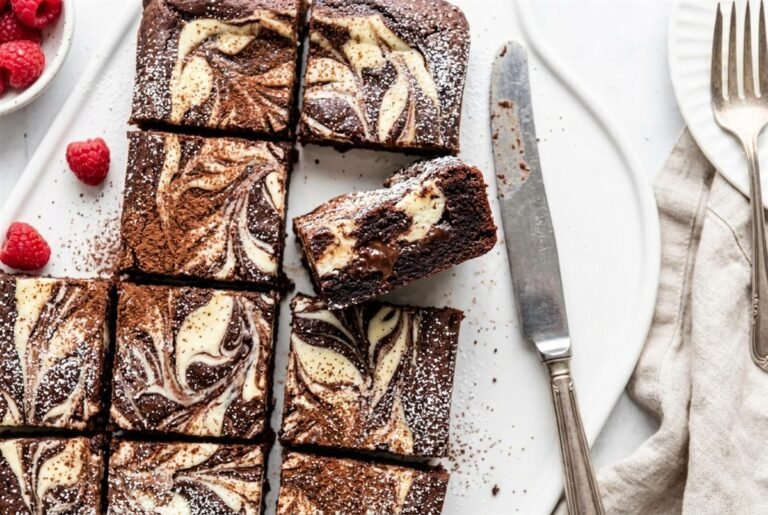 Cream cheese brownies with a white cheesecake swirl marbled into fudgy chocolate.